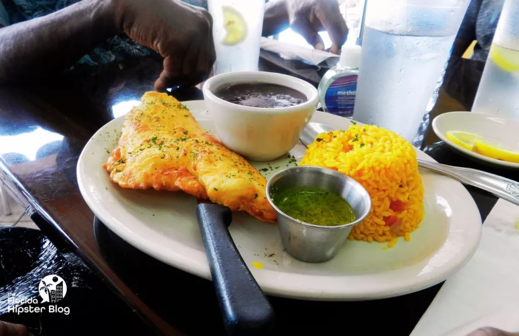 Rumba Cuban Cafe in Naples, Florida fried fish with yellow rice and black beans. One of the best places to get brunch in Naples, Florida