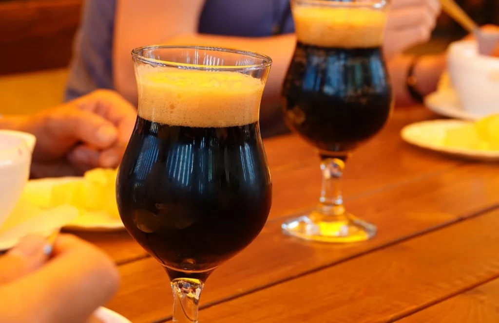 People sitting at a table drinking pints of beer. Keep reading to find out more about things to do in Orlando tonight. 