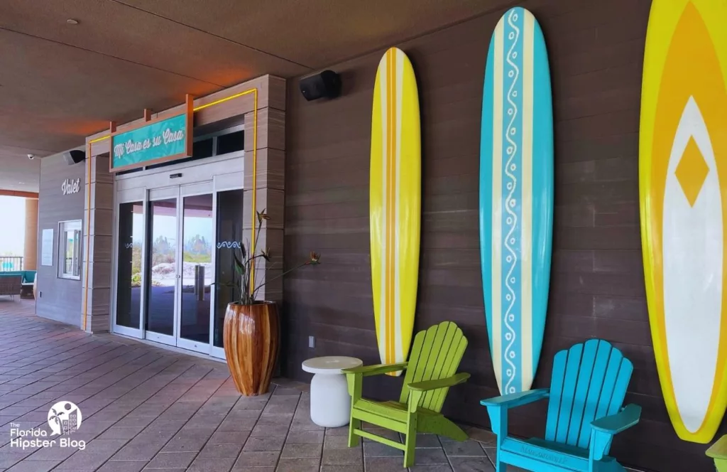 Margaritaville Beach Hotel Entrance and Valet Area with surfboards mounted on the walls. Keep reading to find out all about Margaritaville Hotel Jacksonville Beach.