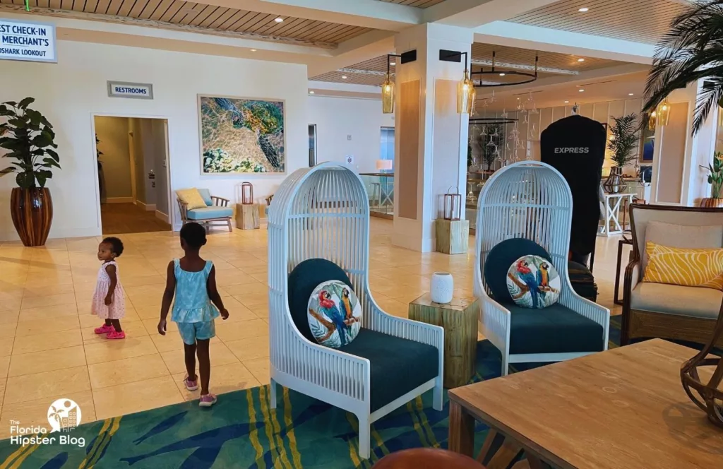 Margaritaville Beach Hotel lobby area with little black girls walking around looking at all the beach décor. Keep reading to learn more about Margaritaville Hotel Jacksonville Beach.