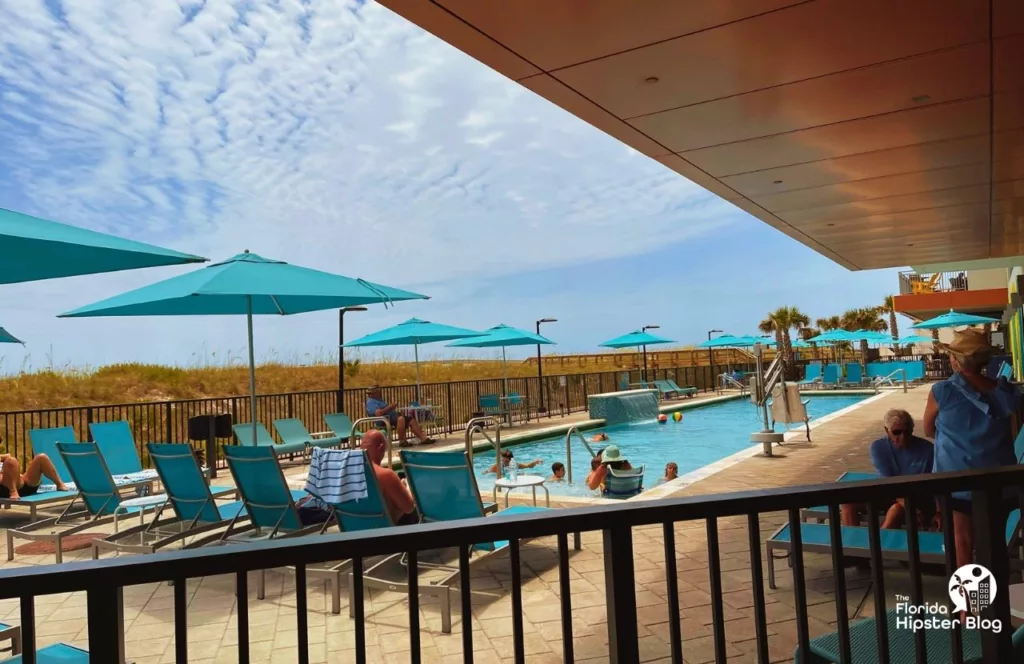 Margaritaville Beach Hotel pool area. Keep reading to learn more about Margaritaville Hotel Jax Beach.