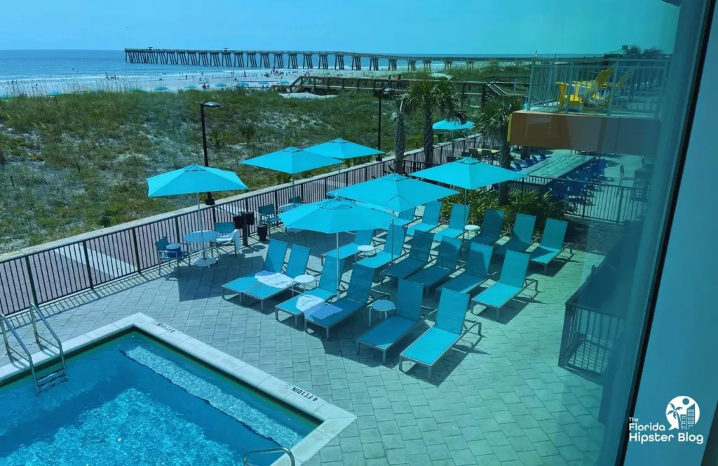 One of the best things to do in Jacksonville, Florida. View of the beach and pier from Margaritaville Beach hotel. Keep reading to get the best beaches in florida for bachelorette party.