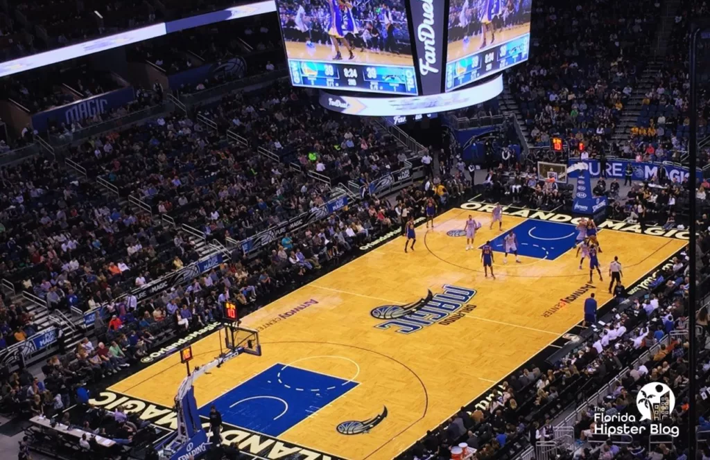 Aerial view of an Orlando Magic Game in Orlando, Florida with the seats filled with basketball fans. Keep reading to learn more about Orlando nightlife.