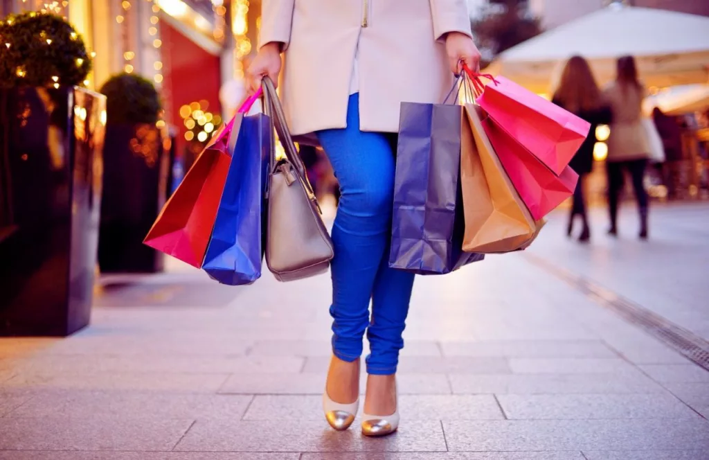 St. Johns Town Center at Christmas Time with lady holding bags upclose. One of the best fun and free things to do in Jacksonville, Florida