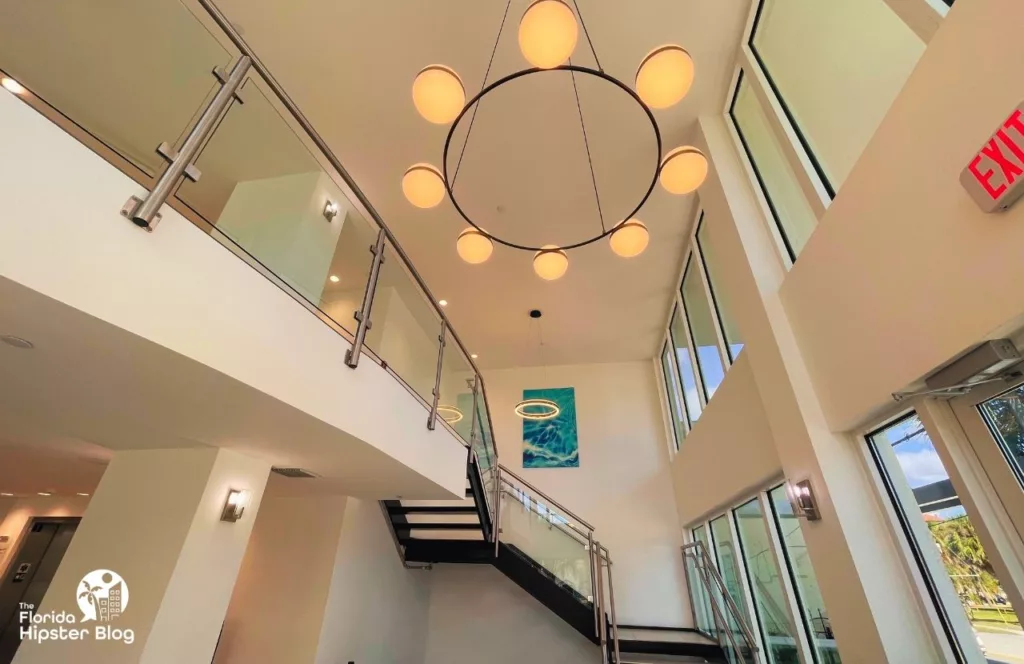 The Avalon Hotel in Clearwater lobby with large hanging chandelier with modern boutique style. Keep reading learn more about the Avalon Club Hotel Clearwater.