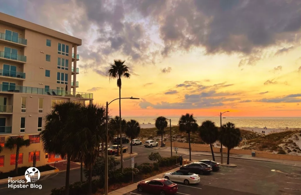 The Avalon Hotel in Clearwater with a beach view of the sunset on the Gulf of Mexico. Keep reading to find out more about The Avalon Club Hotel.