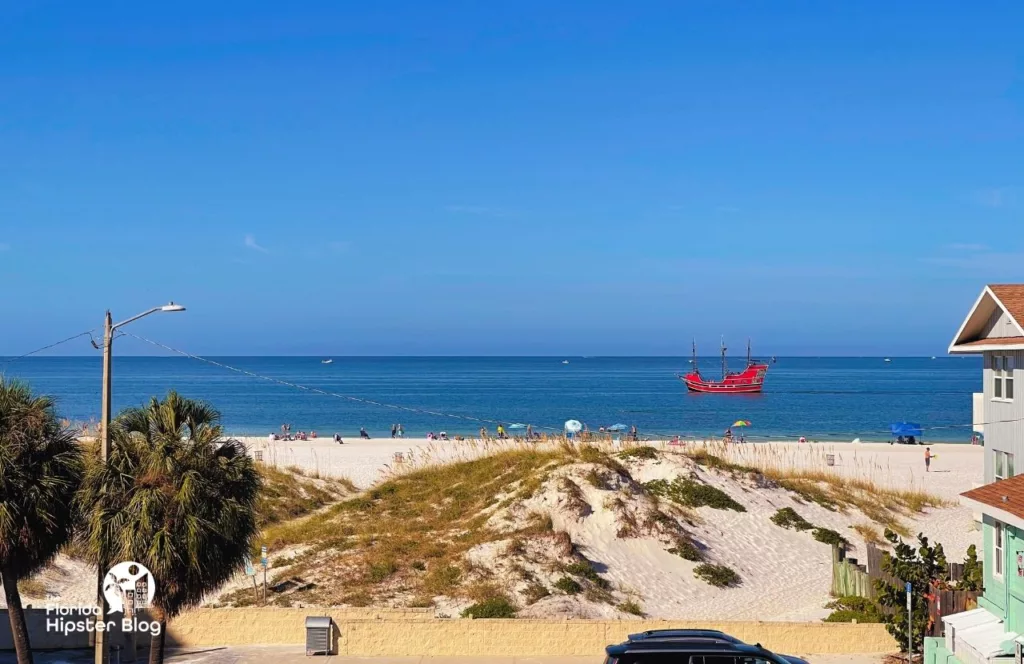 The Avalon Hotel in Clearwater. One of the best places to stay in Tampa. Gulf of Mexico beach View from the balcony with Pirate ship. Keep reading to get the best beaches in florida for bachelorette party.