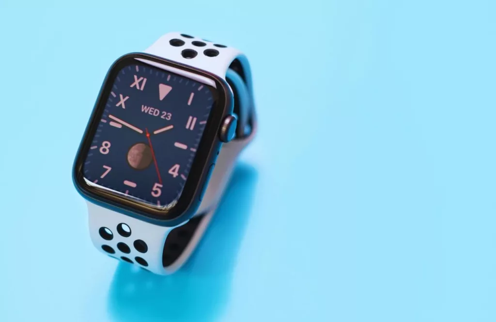 Apple watch on blue background. Keep reading to get the best watch travel cases and boxes.