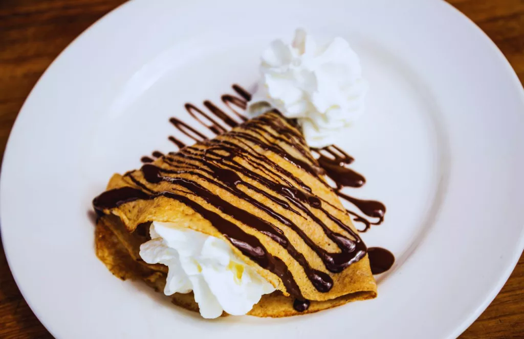 Creme de la Creme crepe with nutella and whipped cream. One of the best places for Breakfast in Naples, Florida