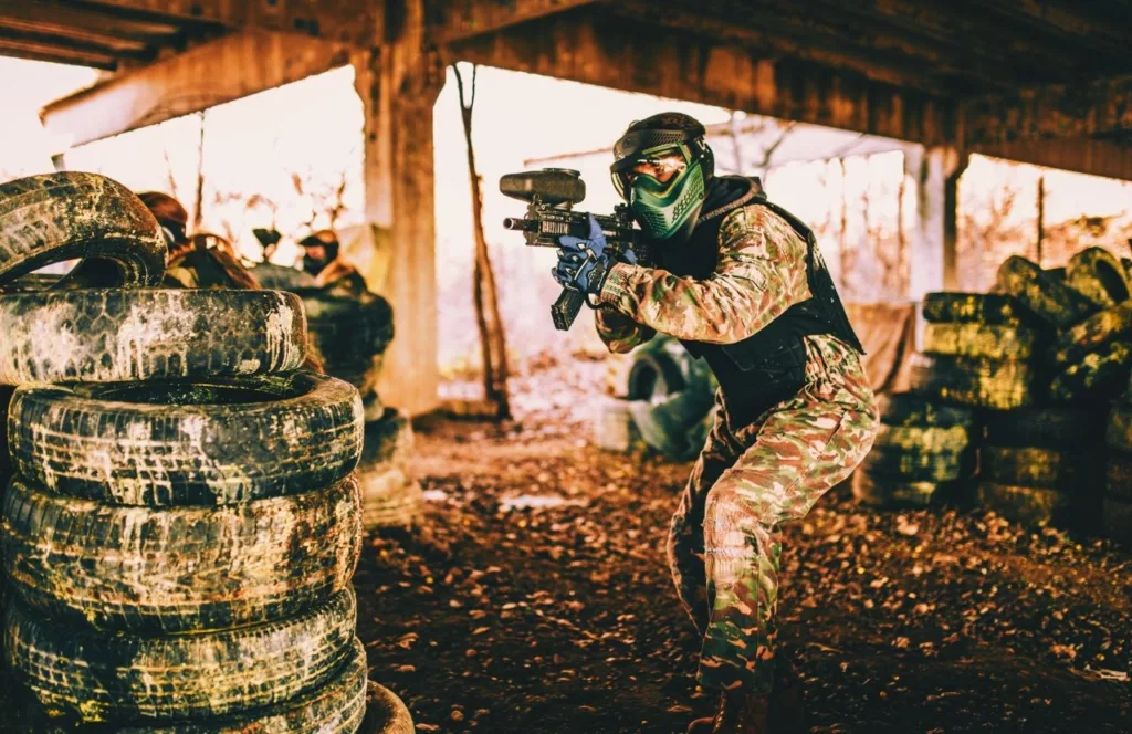 Guy in Camouflage. Keep reading to get the Best Paintball Fields in Orlando, Florida.