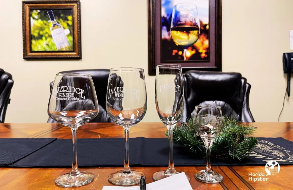 Private VIP Tour Wine Tasting room with wine glasses lined up for the tasting at Lakeridge Winery in Clermont, Florida. Keep reading to learn more about Florida’s largest winery. 