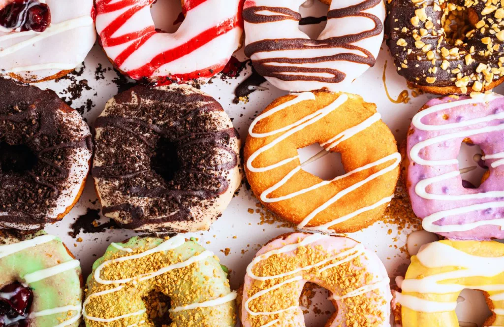 Thomas Donut & Snack Shop with doughnuts in a box. One of the best places to get breakfast in Panama City Beach, Florida. Keep reading to learn more about breakfast in Panama City Beach.