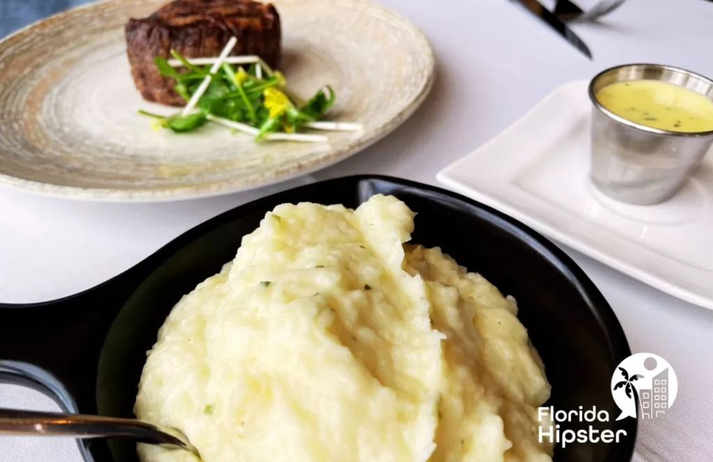 7593 Chophouse at Reunion Resort steakhouse with filet mignon and mashed potatoes. One of the best restaurants in Orlando, Florida. Keep reading to find out more about Orlando steakhouses.