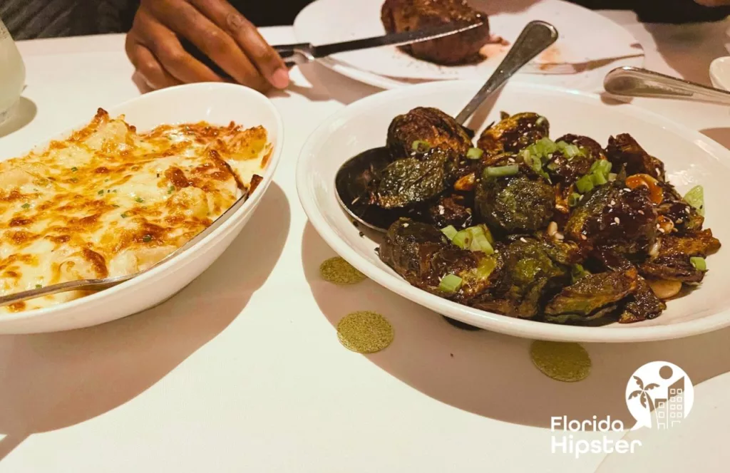 Eddie Vs Prime Seafood and Steakhouse cheesy potatoes and brussel sprouts. Keep reading to find out more about the best steakhouses in Tampa.  