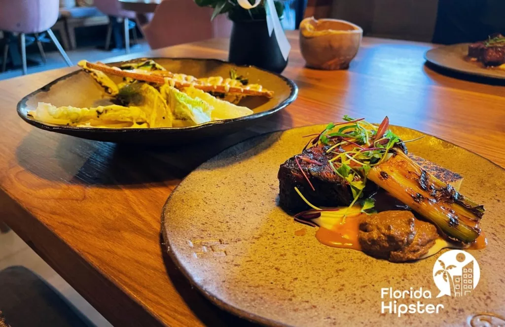 The H Steakhouse Caesar salad and Filet mignon. Keep reading to find out where to go for the best steak in Orlando.