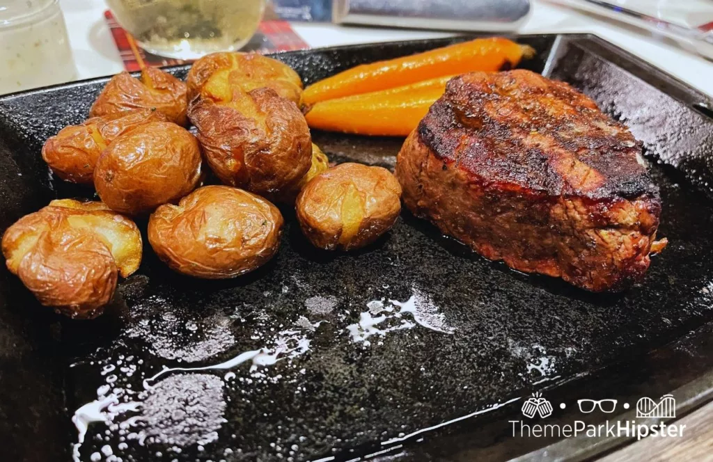 Universal-Orlando-Resort-Steak-potatoes-and-carrots-at-Big-Fire-Grill-in-Citywalk. Keep reading to learn more about Orlando steakhouses. 