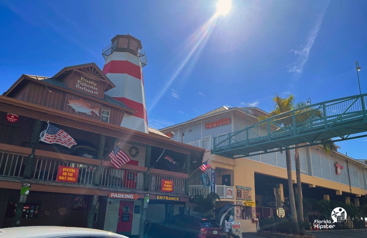 Treasure Island Beach, Florida Madeira Beach John's Pass Boardwalk Hooters and Friendly Fisherman Restaurant Summertime.