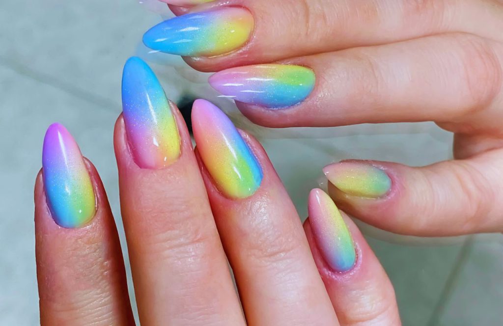 Florida Beach Nails Rainbow Ombre Nails with Glitter. Keep reading to find out more ideas for beach nails for a Florida beach vacation. 